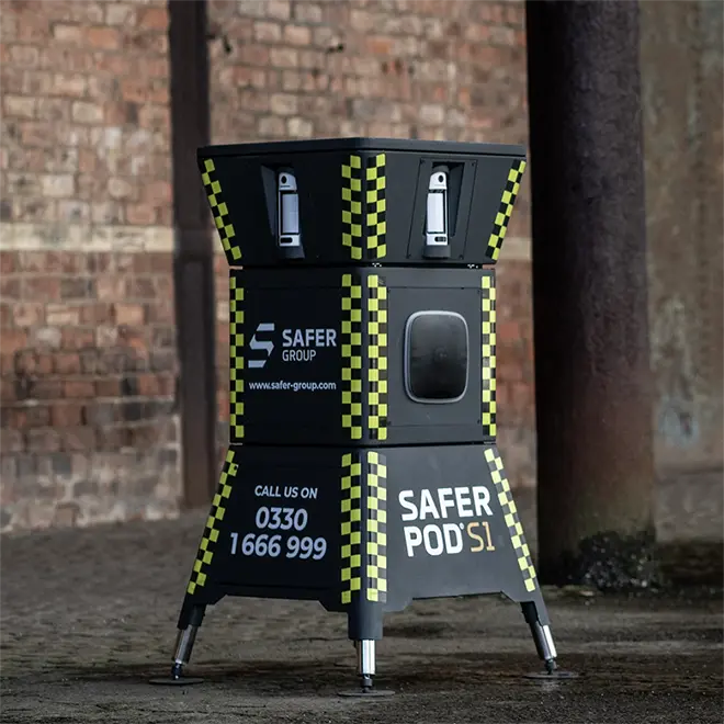 Safer POD S1 security device in front of a brick wall.