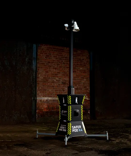Safer POD X4 outside a dark warehouse at night.